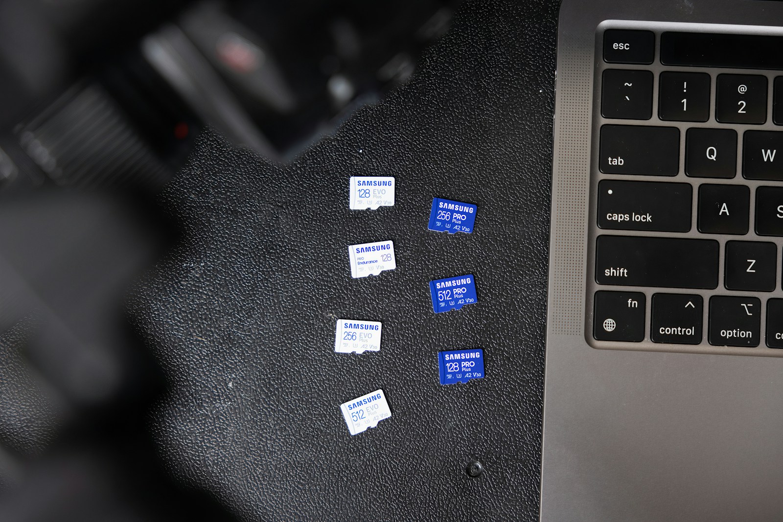 a black keyboard and a black laptop